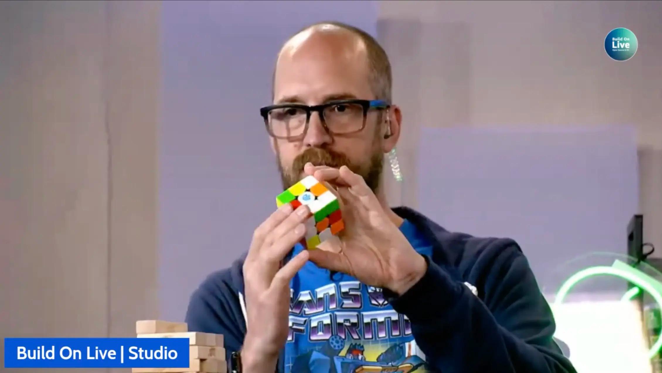Mike solves a Rubiks cube for us