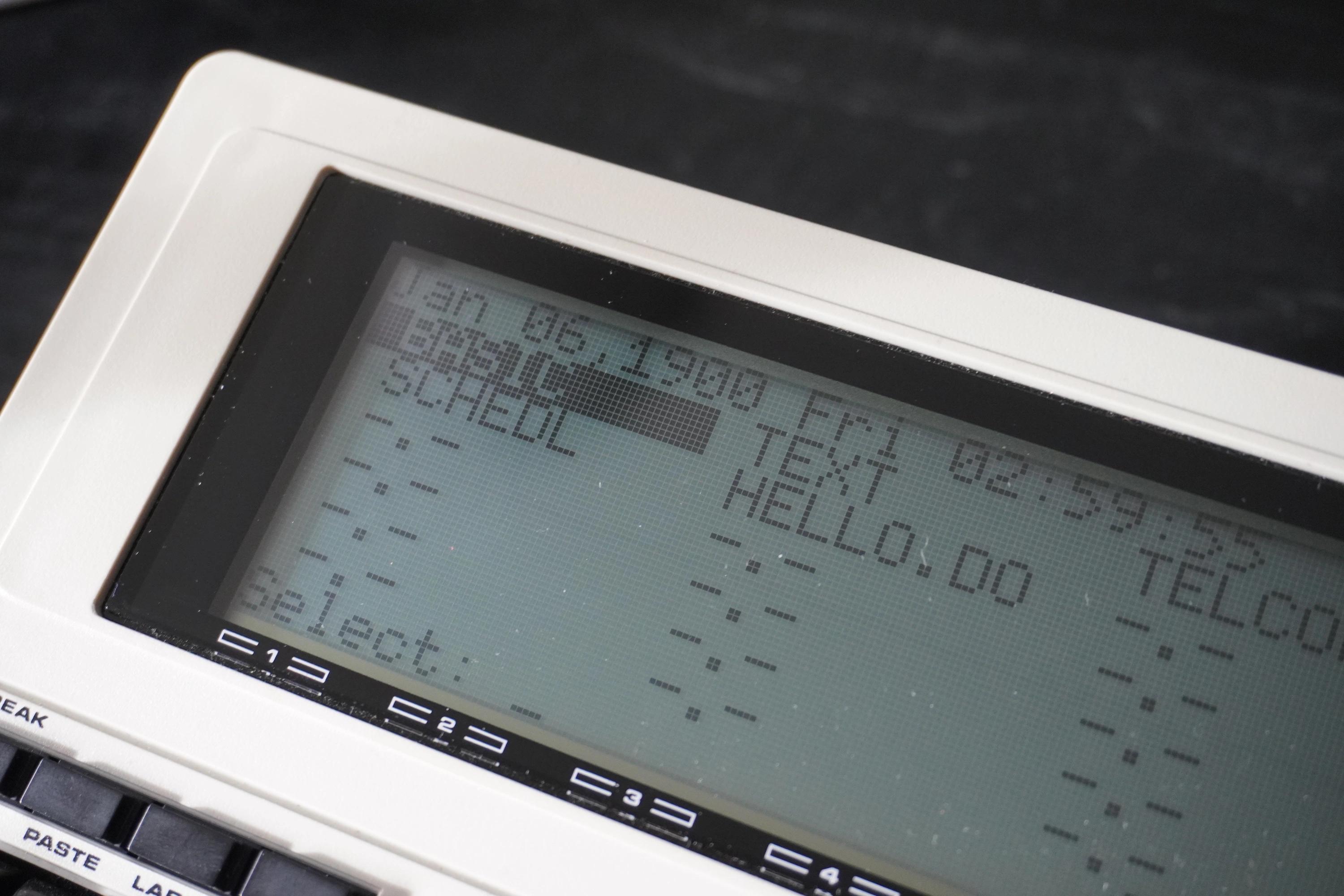 Tandy 102 screen showing its applications in a grid layout. The BASIC application is currently selected