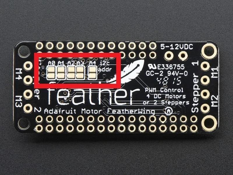 Image of FeatherWing shows I2C Address pins